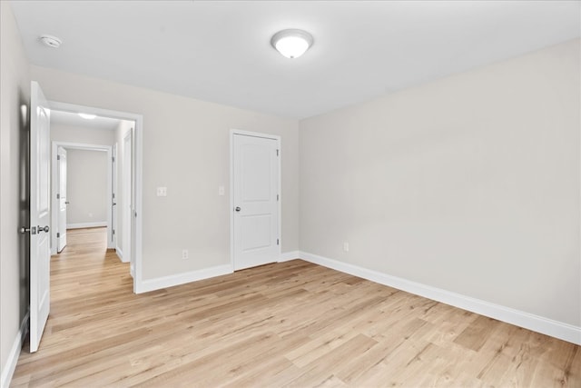 288 Flag Way, Chatsworth, GA 30705 - unfurnished bedroom with baseboards and light wood-type flooring