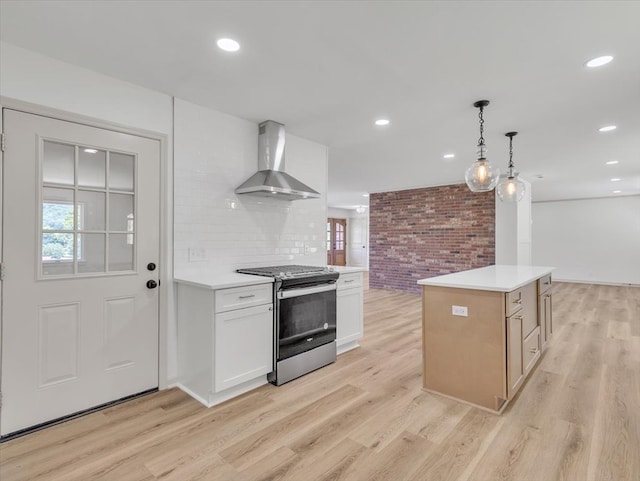 100 Tibbs Rd, Dalton, GA 30720 - kitchen with wall chimney range hood, stainless steel range with gas stovetop, light wood-type flooring, light countertops, and recessed lighting