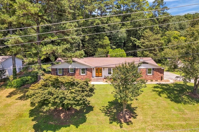 100 Tibbs Rd, Dalton, GA 30720 - view of front of property with brick siding, a front yard, and a chimney