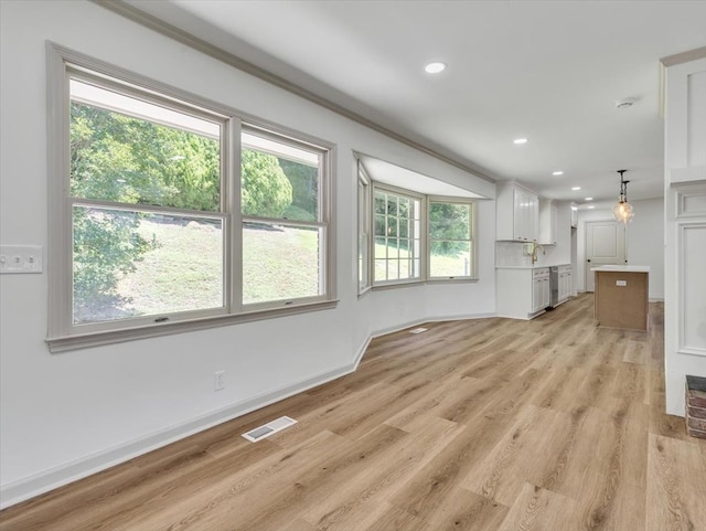 100 Tibbs Rd, Dalton, GA 30720 - unfurnished living room featuring light wood finished floors and recessed lighting
