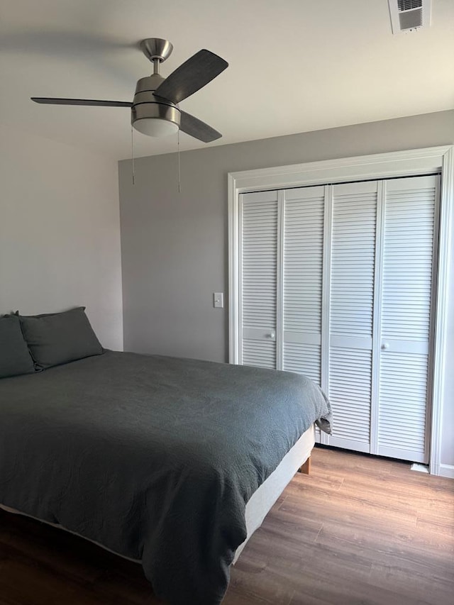 303 Janice St, Dalton, GA 30721 - bedroom with a closet, wood finished floors, and ceiling fan