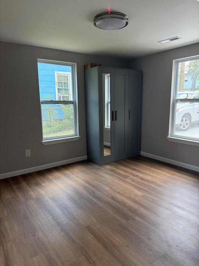 303 Janice St, Dalton, GA 30721 - unfurnished bedroom featuring wood finished floors