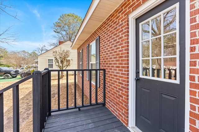 exterior space with brick siding