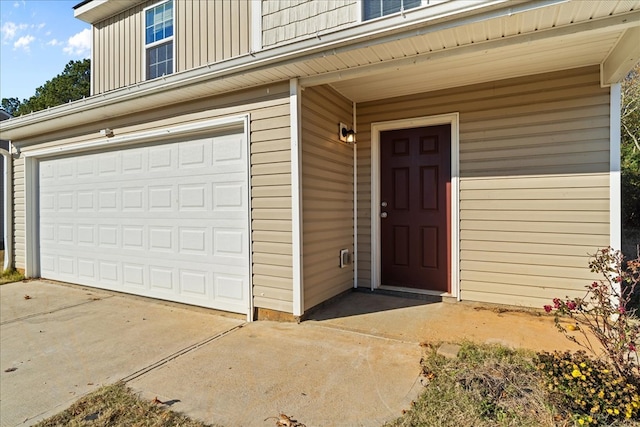 property entrance with a garage