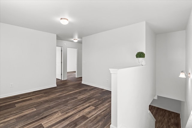 unfurnished room featuring dark hardwood / wood-style flooring