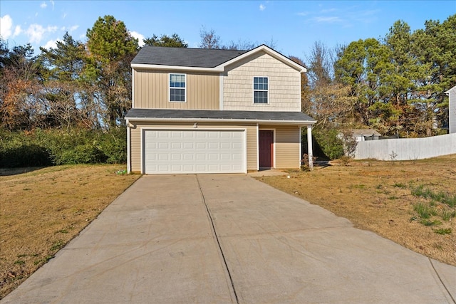 view of front facade with a garage and a front yard