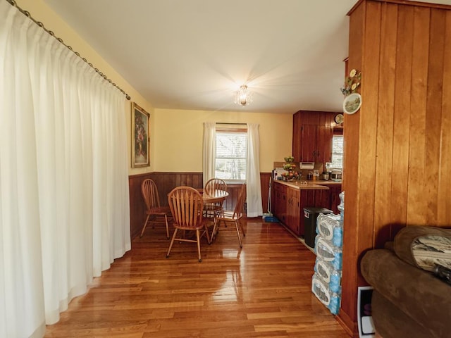 209 Kenemer Cir, Dalton, GA 30720 - dining room featuring light wood-style flooring, wood walls, and wainscoting