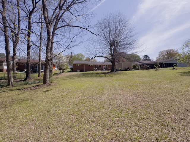 209 Kenemer Cir, Dalton, GA 30720 - view of grassy yard featuring a carport