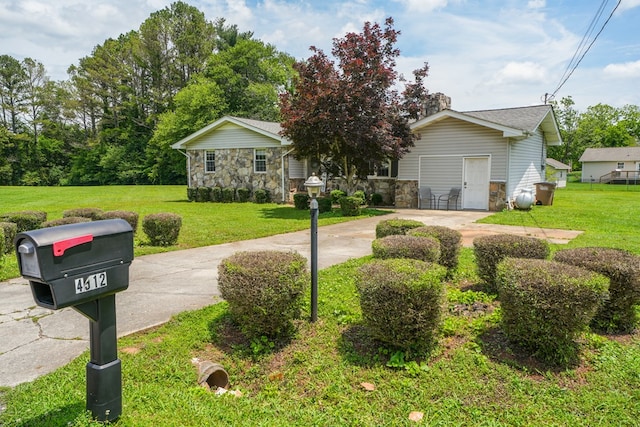 view of front of home with stone siding and a front lawn