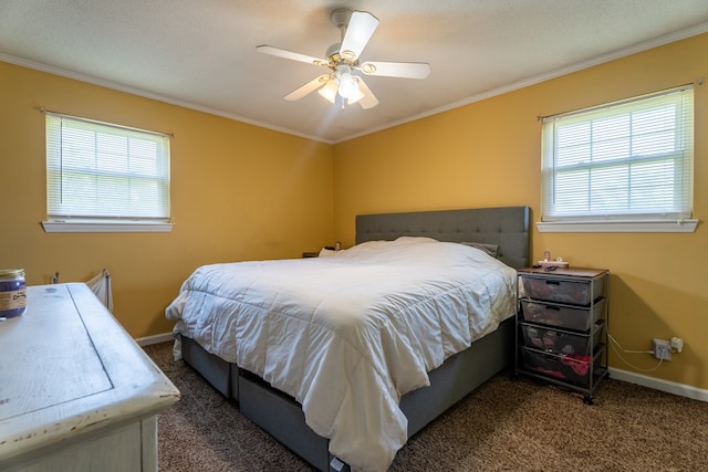 carpeted bedroom with ornamental molding, baseboards, and a ceiling fan