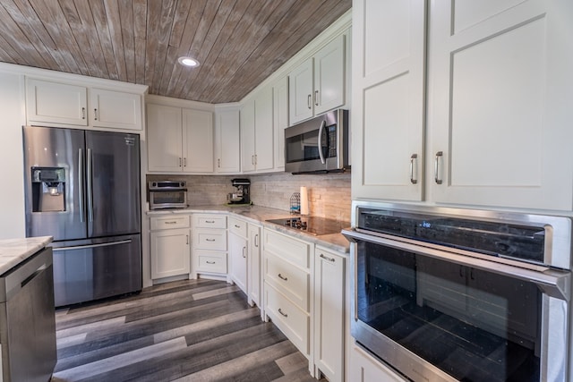 kitchen with appliances with stainless steel finishes, wooden ceiling, white cabinets, recessed lighting, and dark wood finished floors