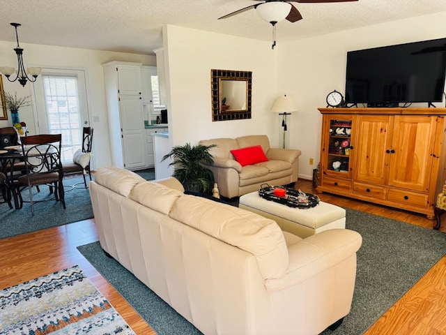 4511 Crestway Dr, Cohutta, GA 30710 - living area featuring a ceiling fan, wood finished floors, a textured ceiling, and a chandelier