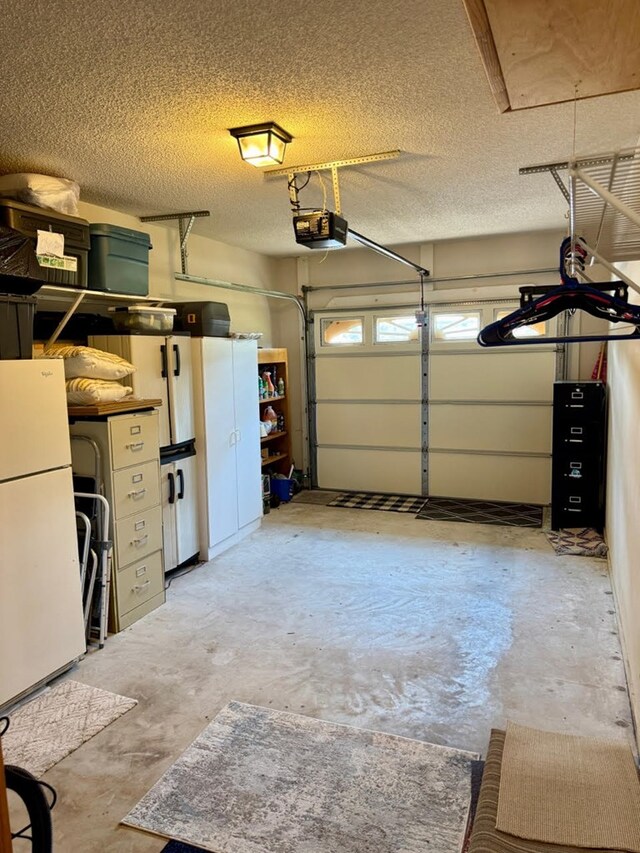 4511 Crestway Dr, Cohutta, GA 30710 - garage featuring freestanding refrigerator and a garage door opener