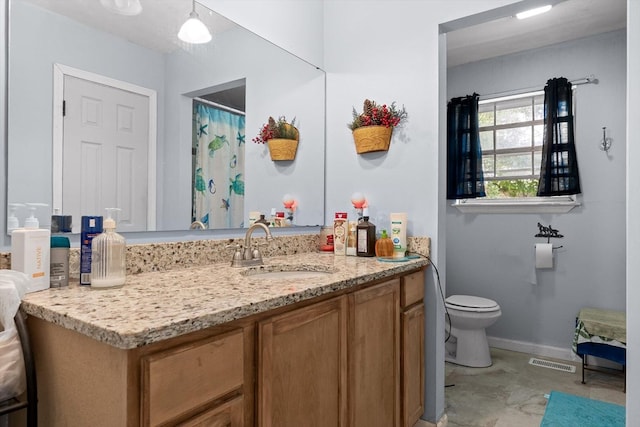 bathroom featuring toilet, baseboards, visible vents, and vanity