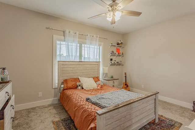 bedroom featuring light carpet, ceiling fan, and baseboards