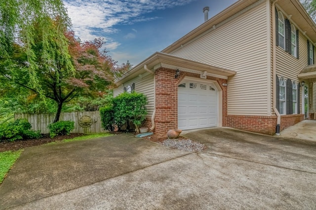 1694 Burnt Oak Dr Unit 208, Dalton, GA 30721 - view of property exterior with brick siding, an attached garage, and concrete driveway