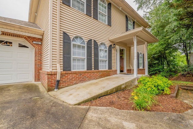 1694 Burnt Oak Dr Unit 208, Dalton, GA 30721 - view of front of house with brick siding, driveway, and a garage