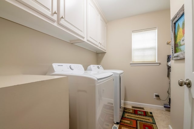 1694 Burnt Oak Dr Unit 208, Dalton, GA 30721 - washroom with washer and clothes dryer, cabinet space, and light tile patterned floors