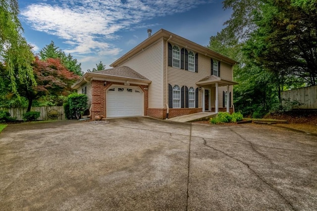 1694 Burnt Oak Dr Unit 208, Dalton, GA 30721 - colonial home with an attached garage, concrete driveway, and brick siding
