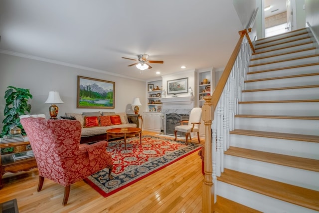 1694 Burnt Oak Dr Unit 208, Dalton, GA 30721 - living room with stairs, hardwood / wood-style flooring, a ceiling fan, a fireplace, and ornamental molding
