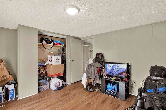 interior space featuring hardwood / wood-style floors and a textured ceiling