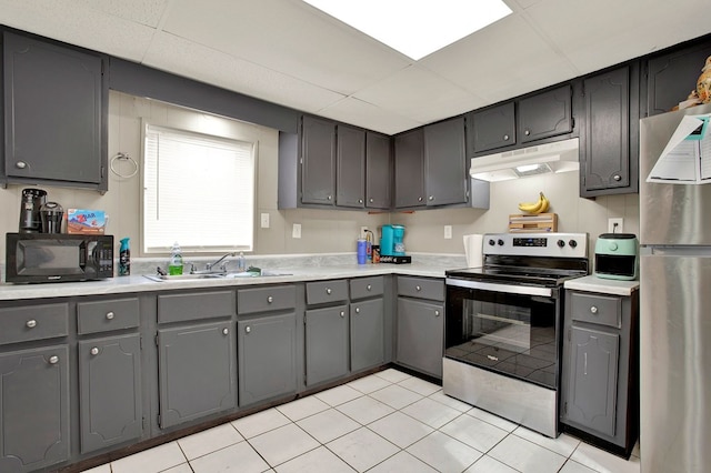 2032 Mill Creek Rd, Rocky Face, GA 30740 - kitchen with sink, light tile patterned floors, gray cabinets, a paneled ceiling, and appliances with stainless steel finishes