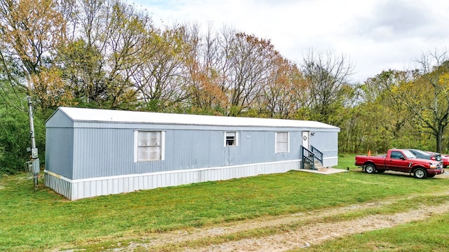 view of outdoor structure with a yard