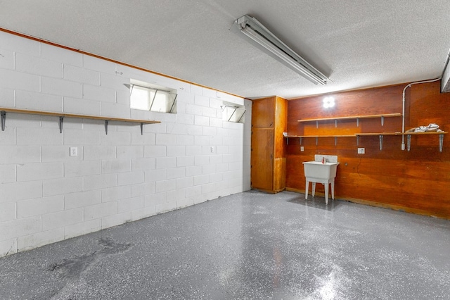 1590 Peavine Rd, Rock Spring, GA 30739 - finished basement with concrete block wall, a textured ceiling, and a sink