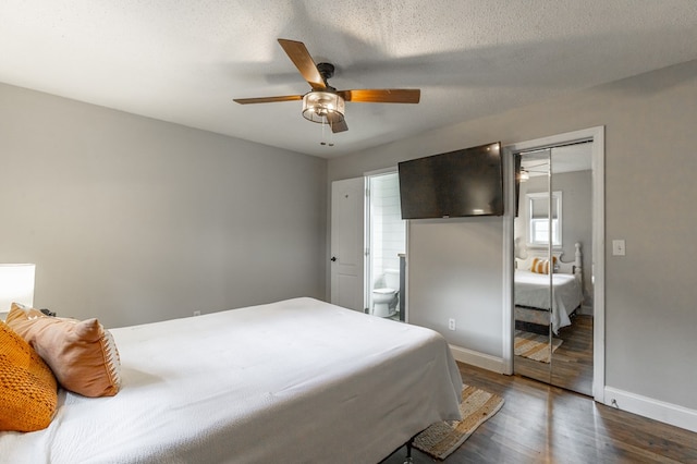 1590 Peavine Rd, Rock Spring, GA 30739 - bedroom with ceiling fan, wood finished floors, baseboards, a closet, and ensuite bathroom
