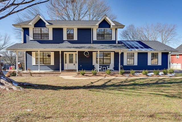 view of front of home featuring covered porch and a front yard