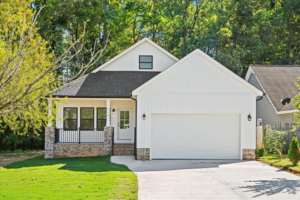 LOT63 Washington St, Dalton, GA 30721 - modern inspired farmhouse featuring brick siding, an attached garage, a shingled roof, a front lawn, and concrete driveway