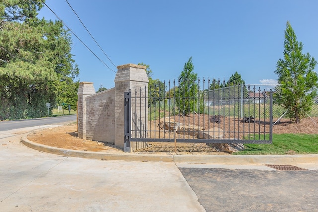 view of gate featuring fence