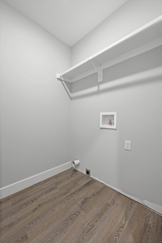 laundry area featuring hookup for a washing machine, hookup for an electric dryer, laundry area, wood finished floors, and baseboards