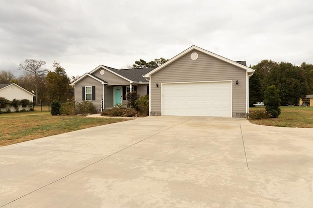 ranch-style home featuring a garage and a front yard