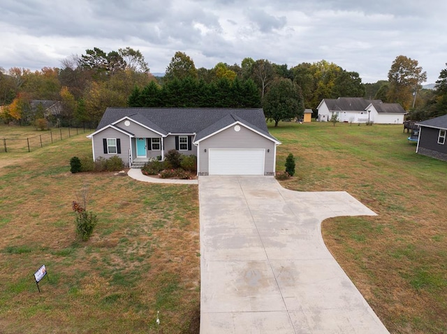 single story home featuring a garage and a front yard