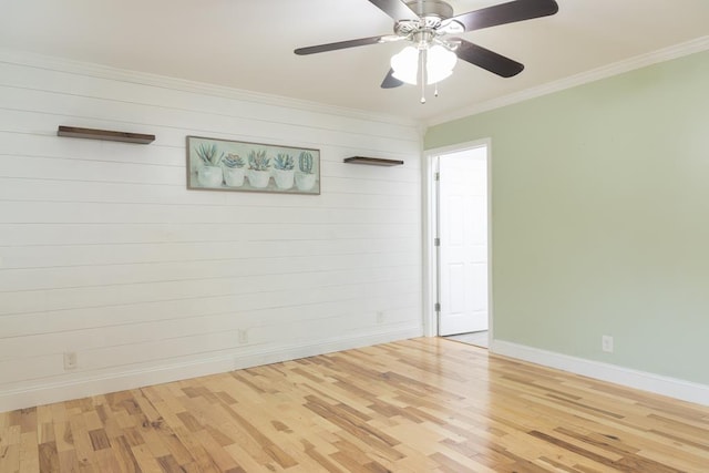 spare room featuring ornamental molding, ceiling fan, and light hardwood / wood-style floors