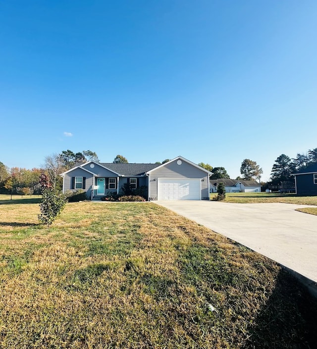 ranch-style house featuring a garage and a front lawn