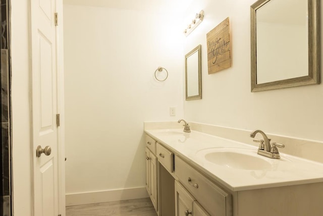 bathroom featuring vanity and hardwood / wood-style floors