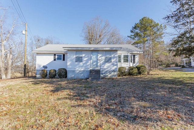 view of property exterior with a yard