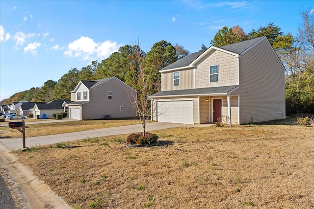 132 Village Creek Dr, Chatsworth, GA 30705 - view of front of house featuring a garage, concrete driveway, and a front yard