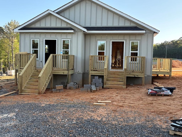 4327 Cronan Dr, Cohutta, GA 30710 - view of front of house with board and batten siding, a deck, roof with shingles, and stairway