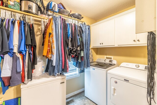 207 Pine St, Chatsworth, GA 30705 - laundry room with separate washer and dryer, cabinet space, and a textured ceiling
