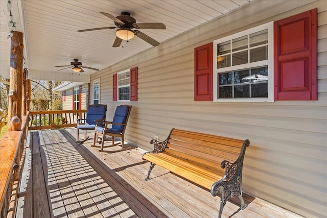 wooden terrace featuring ceiling fan and covered porch