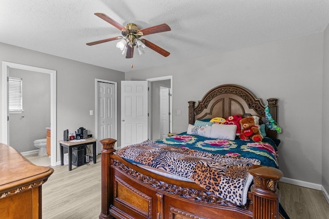 163 Shawn Ln, Chatsworth, GA 30705 - bedroom featuring light wood-style floors, connected bathroom, a textured ceiling, and a ceiling fan
