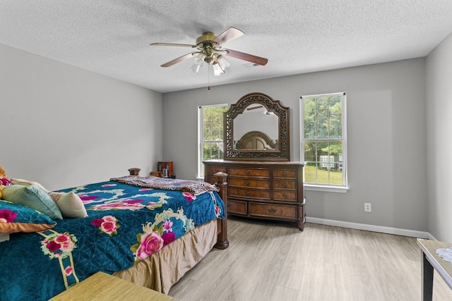 163 Shawn Ln, Chatsworth, GA 30705 - bedroom with wood finished floors, a textured ceiling, and ceiling fan