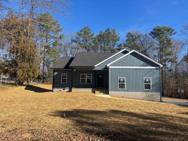 view of front of property with board and batten siding and roof with shingles