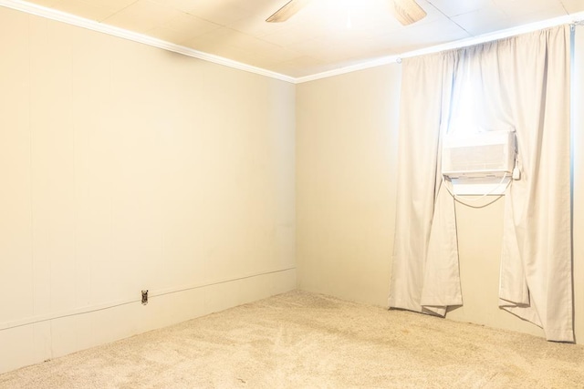 carpeted empty room featuring crown molding and ceiling fan