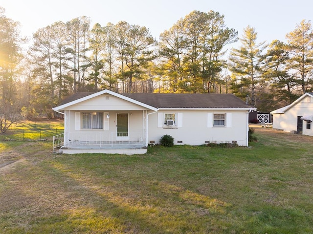 view of front of property with cooling unit, a front lawn, and covered porch