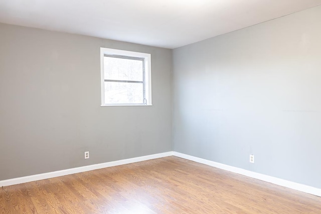 unfurnished room with light hardwood / wood-style flooring