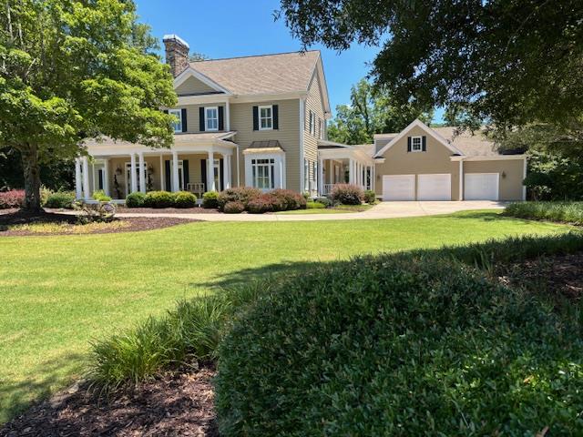 200 Goose Hill Rd, Rocky Face, GA 30740 - view of front facade featuring a chimney, driveway, a front lawn, and an attached garage